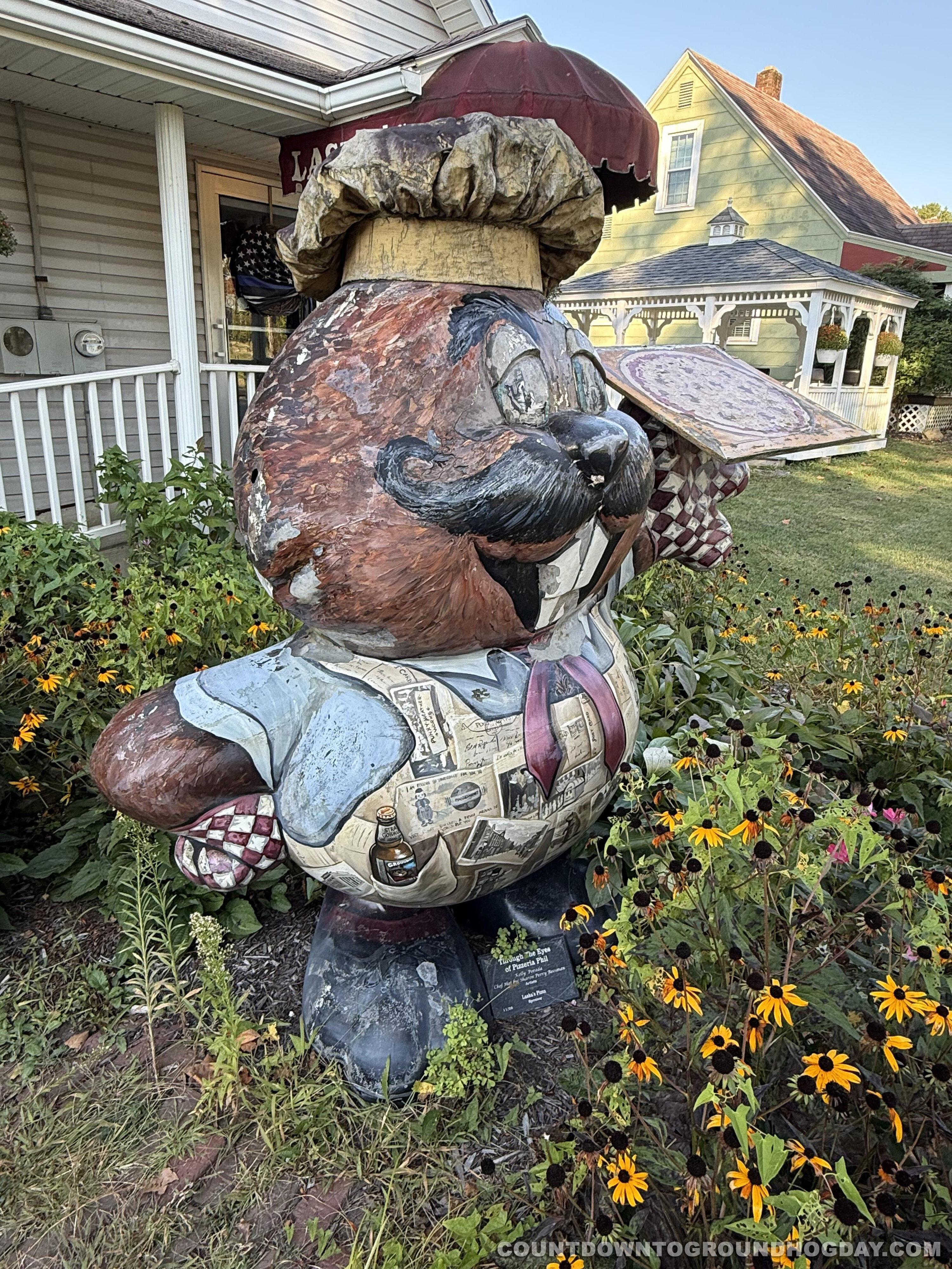 'Through the Eyes of Pizzeria Phil' stands outside Laska's Pizza